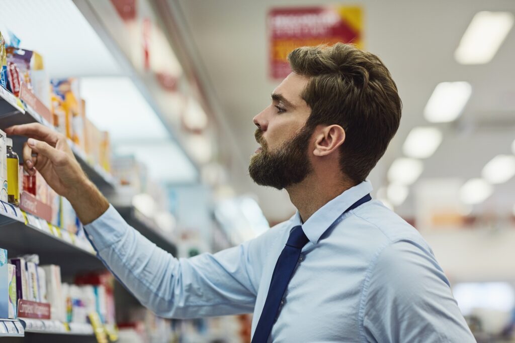 Man choosing between generic vs branded finasteride